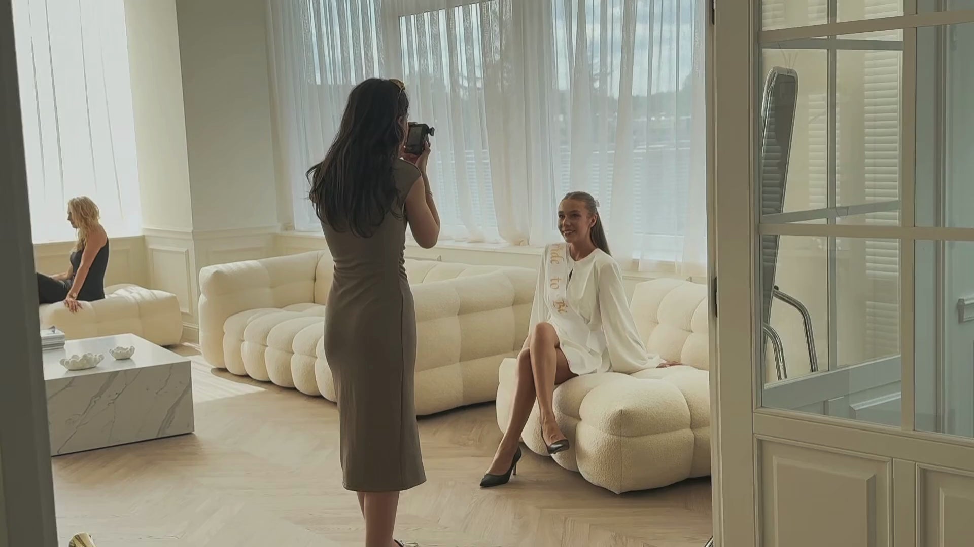 Model posing gracefully during a professional studio session. Liza Peker shooting backstage.